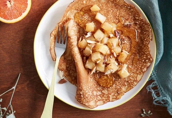 Spelt pancakes topped with apples